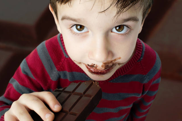 Child eating chocolate