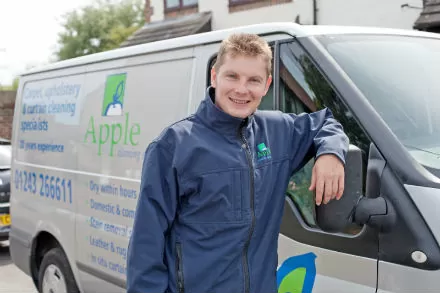 Apple Clean smiling man in front of van